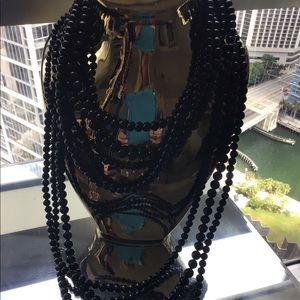 Multi strand black bead necklace with earrings.